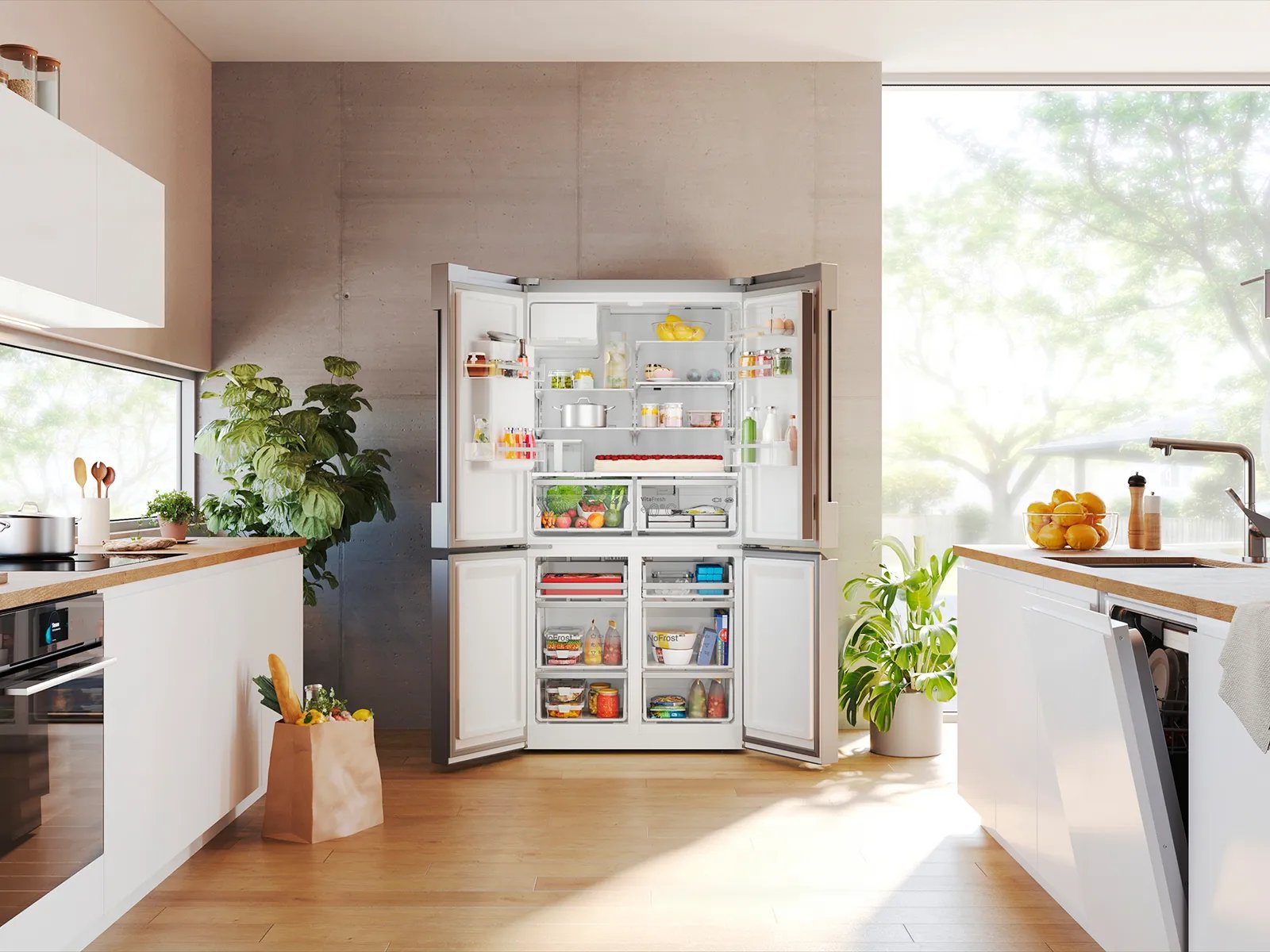 Cocina moderna con refrigerador abierto mostrando alimentos organizados en estantes y congelador inferior